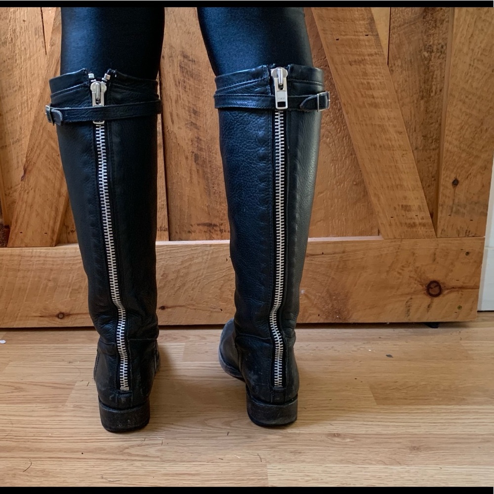 Black leather riding boots with metal zipper